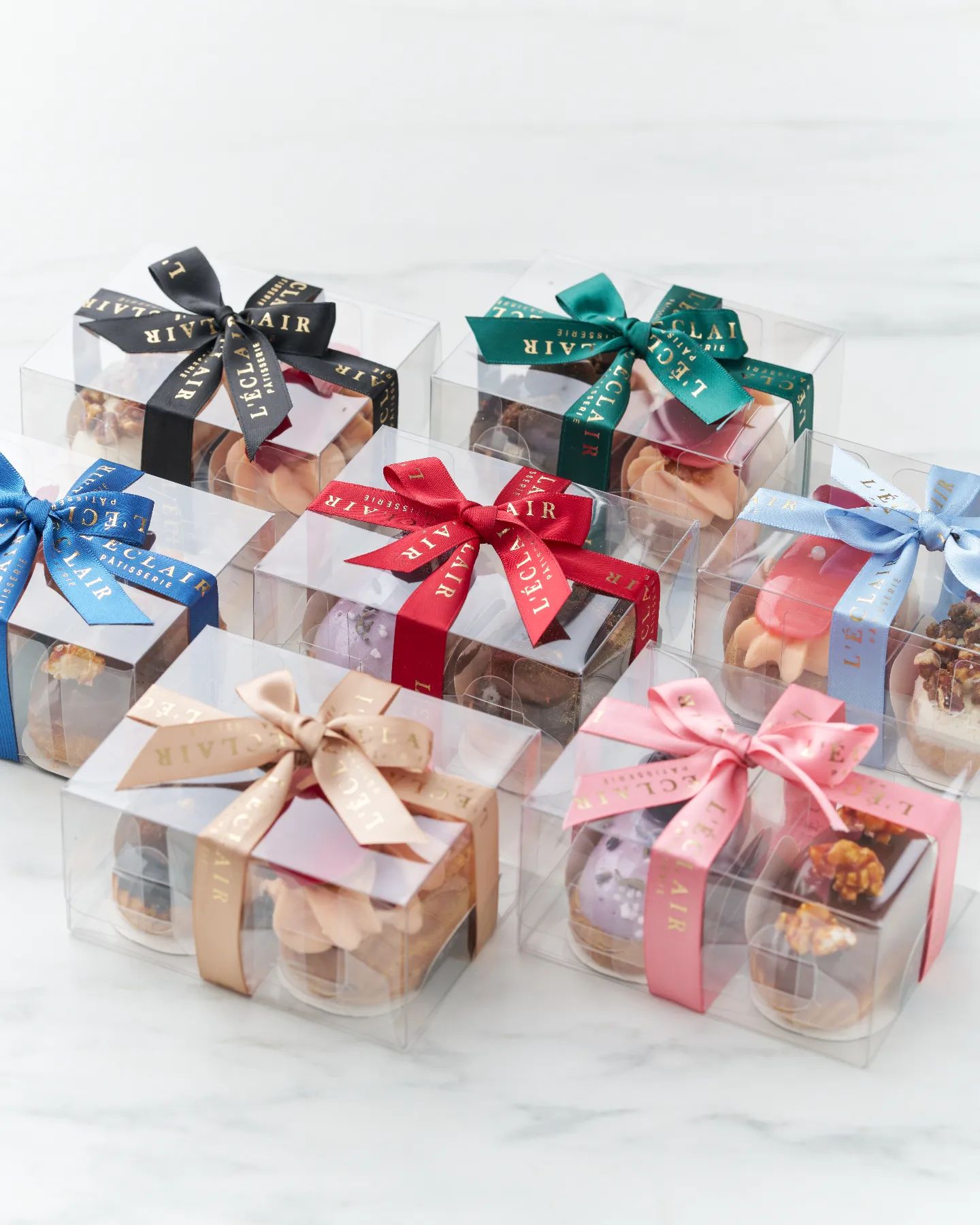 A gift from the heart for every occasion ❤️ 

Customise these edible favours with any two éclair flavours. Each box is complete with a beautiful ribbon of your choice. 

Check out the preorder details on our website - www.leclair.com.sg/shop.